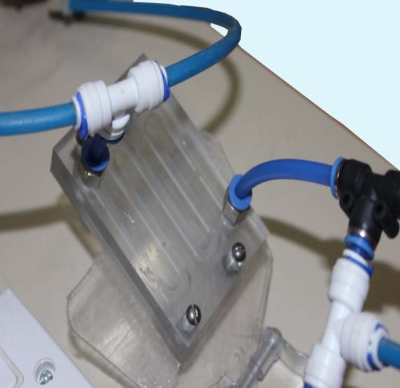 microreactor via the two micropumps. The initial feed temperature was measured by two mercury thermometers immersed into the bottles.Microreactor effluent was collected in a graduated 500 mL container.