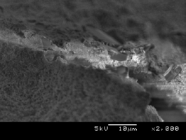 Figure 7 : SEM images of a crack in the surface of the IMP sample from Section 5